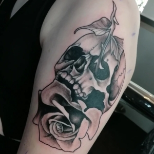 Neo-traditional black and gray tattoo